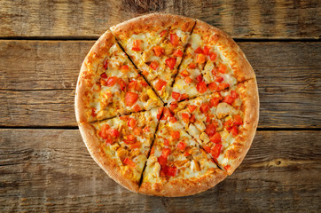 Pizza with cheese, chicken and fresh tomato slices