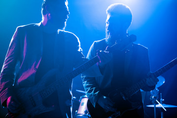 Musicians perform on stage in the club.