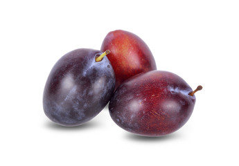 whole fresh prunes on white background