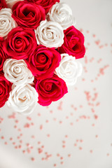 Obraz na płótnie Canvas Red and White roses isolated on a white background with space for text