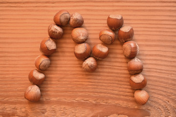the letter M shaped with hazelnuts