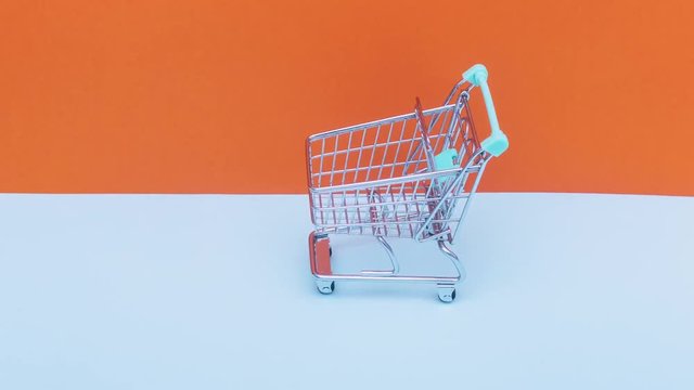 Supermarket cart moving forward. The concept of shopping. Stop motion animation.