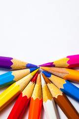 Naklejka premium colored pencils on white background