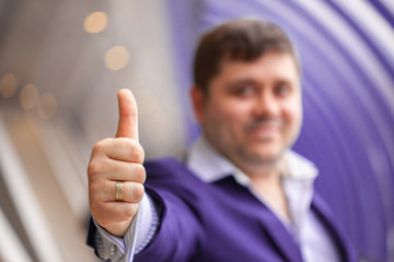 businessman showing thumbs up