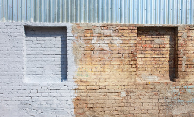 old brick wall with blind windows