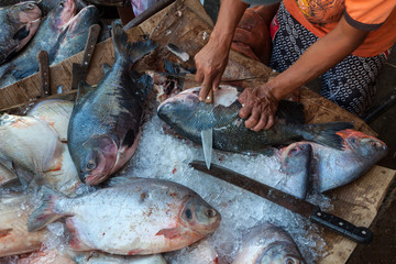 Close up of a man peeling Brazilian 