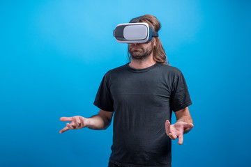 Male potrait wearing VR device looking confused. Virtual device simulator