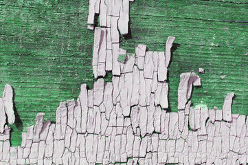 Old wooden texture with peeling paint background with remains of pieces of scraps  Texture of an...