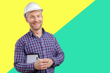 Happy young businessman architect smiling