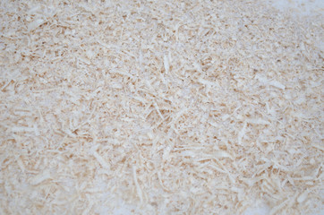 pile of sawdust, wooden background