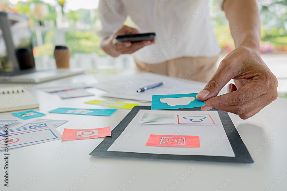 Wall mural creative web designer planning application and developing template layout, framework for mobile phon