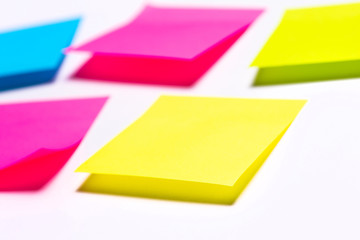 Many colorful sticky notes on white background