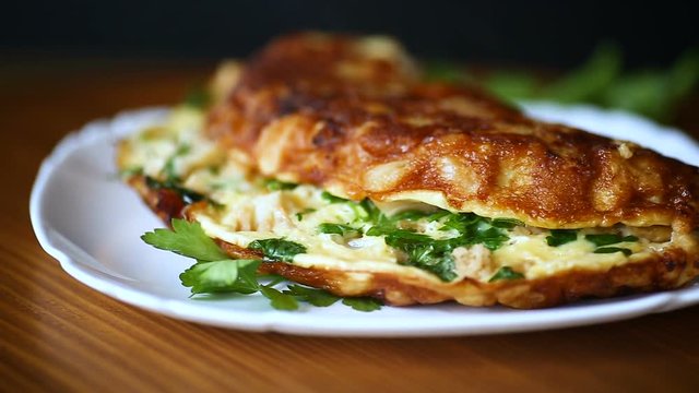 fried omelet with cauliflower and greens in a plate
