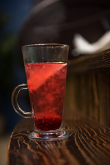 Berries tea on wooden background