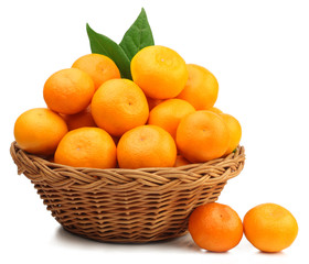 Fresh tangerines in a basket isolated on white