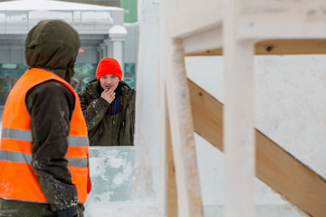 Workers on the installation of the ice town
