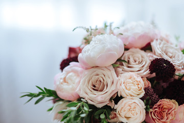 Obraz na płótnie Canvas wedding bouquet with rose bush, Ranunculus asiaticus as a background
