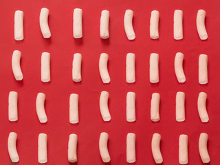 Marshmallows pattern on red background