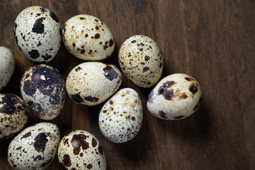 natural organic quail eggs on a wooden table