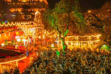 Edinburgh Christmas Market Fair Panorama night view long exposure of streets light Edinburgh sky...