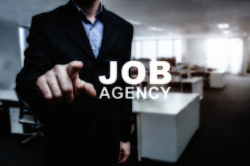 Job loss conceptual. Man in suite in office point hand to job agency for find new work.