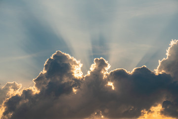 Beautiful sky and clouds The sun shines through the clouds. The shade is a strange look.