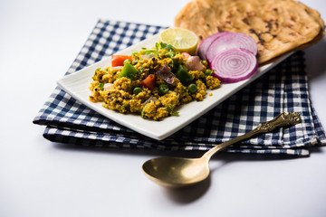 Paneer Bhurji, mildly spiced cottage cheese scramble and served with roti or laccha paratha, selective focus