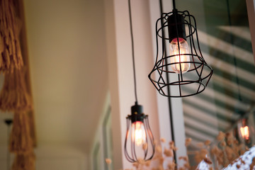 Vintage light bulbs hanging from ceiling decorated in the room.
