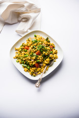 Paneer Bhurji, mildly spiced cottage cheese scramble and served with roti or laccha paratha, selective focus
