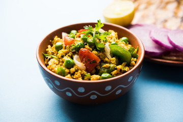 Paneer Bhurji, mildly spiced cottage cheese scramble and served with roti or laccha paratha, selective focus