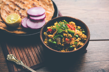 Paneer Bhurji, mildly spiced cottage cheese scramble and served with roti or laccha paratha, selective focus