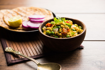 Paneer Bhurji, mildly spiced cottage cheese scramble and served with roti or laccha paratha, selective focus