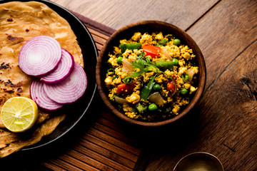Paneer Bhurji, mildly spiced cottage cheese scramble and served with roti or laccha paratha, selective focus