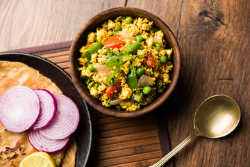 Paneer Bhurji, mildly spiced cottage cheese scramble and served with roti or laccha paratha, selective focus