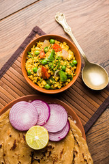 Paneer Bhurji, mildly spiced cottage cheese scramble and served with roti or laccha paratha, selective focus