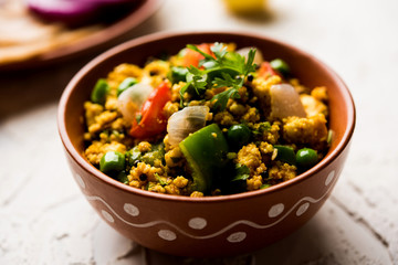 Paneer Bhurji, mildly spiced cottage cheese scramble and served with roti or laccha paratha, selective focus