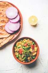 Paneer Bhurji, mildly spiced cottage cheese scramble and served with roti or laccha paratha, selective focus