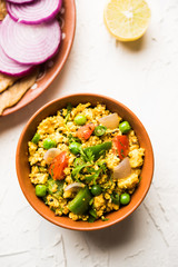 Paneer Bhurji, mildly spiced cottage cheese scramble and served with roti or laccha paratha, selective focus