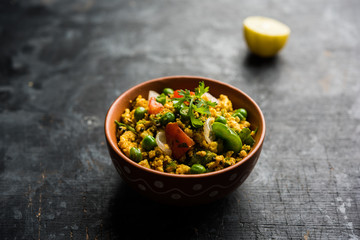 Paneer Bhurji, mildly spiced cottage cheese scramble and served with roti or laccha paratha, selective focus
