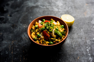 Paneer Bhurji, mildly spiced cottage cheese scramble and served with roti or laccha paratha, selective focus