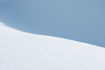Fresh snow background texture. Winter background with snowflakes and snow mounds. Snow lumps.
