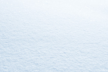 Fresh snow background texture. Winter background with snowflakes and snow mounds. Snow lumps.