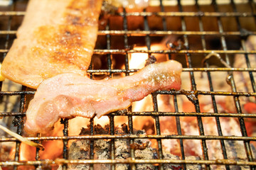 thin slice bacon grilled on hot fire stove ready to eat