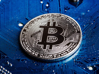 Concept of Bitcoin Mining. Physical bit coin. Digital currency. Cryptocurrency. Silver  bitcoins symbol of Blockchain technology and network concept.
