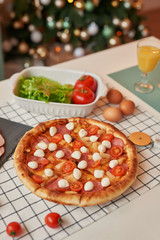 pizza with mozzarella on the Christmas table