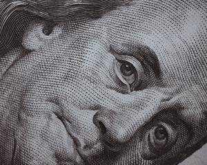 Benjamin Franklin portrait one hundred dollar bill. Macro shot. United States money close-up.