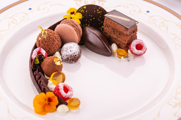 chocolate Babylon. A dessert from different grades of chocolate with berries