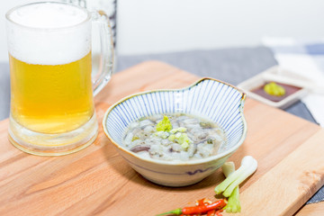 Takowasabi Japanese food with fresh squid and wasabi is served with beer.