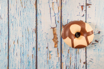Donut on an old and unpainted wood texture