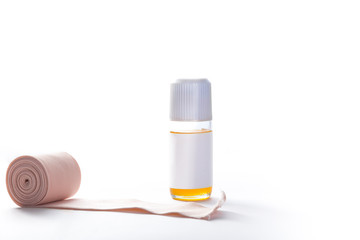 Medicine bottle, relaxing massage With a bandage roll, isolated on white background.